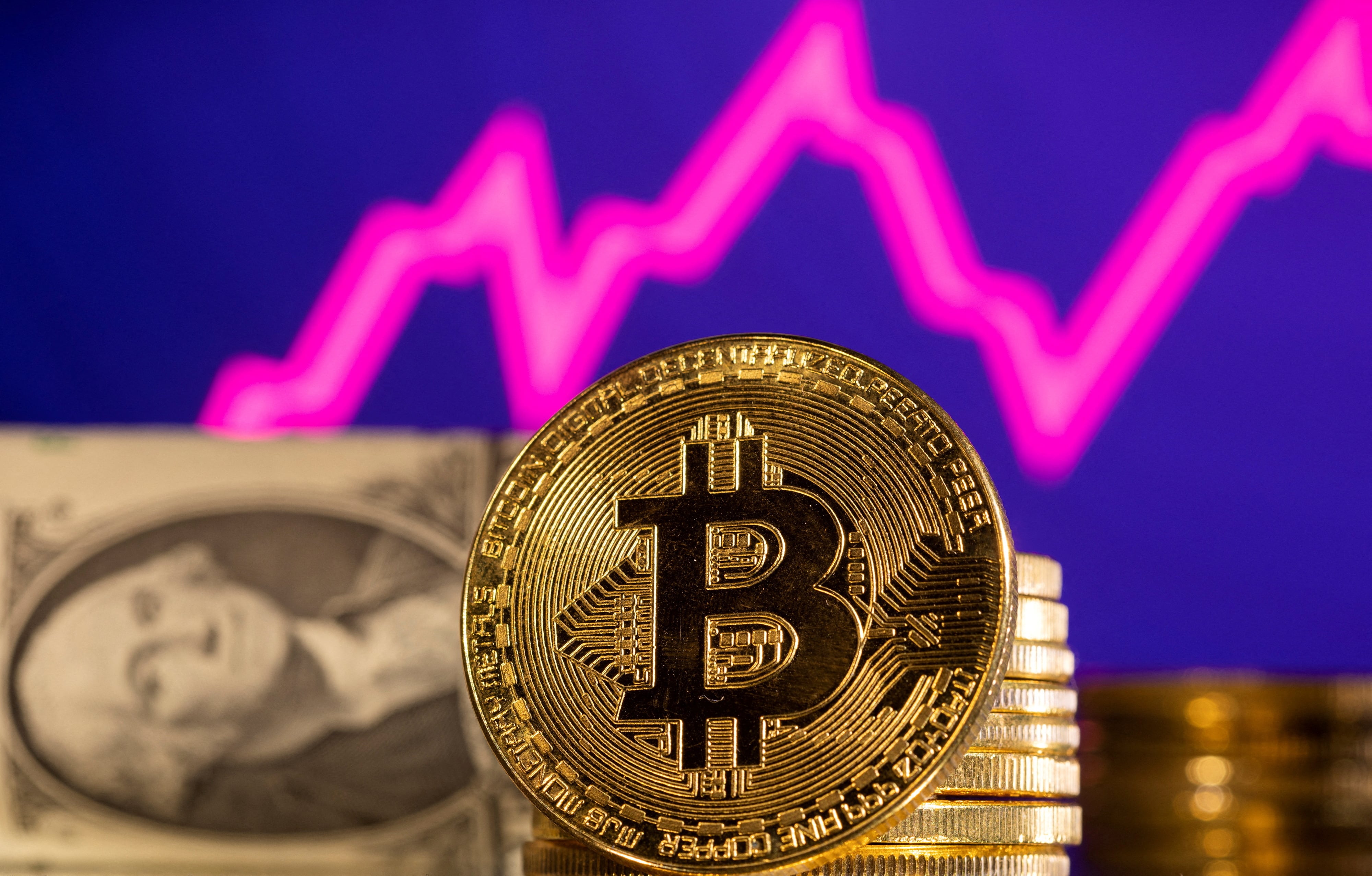 Bitcoin soars to record high, then tumbles | Reuters