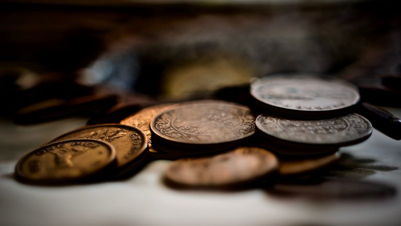 Coins left on tombstones have deeper meaning for some