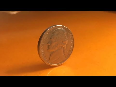 Answered: Movie where coin spins and balances on it's edge - Movie Forums